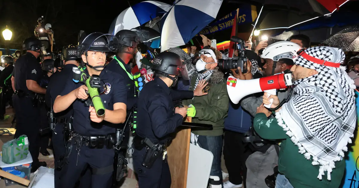 Police mass at UCLA as encampment defies order to leave