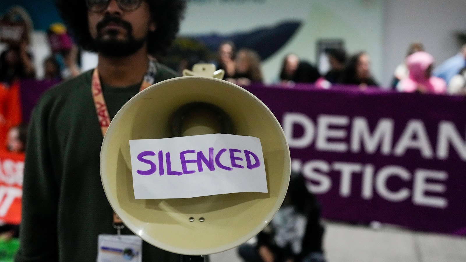 Protesters gather at UN climate talks in global day of action as progress on a deal slows